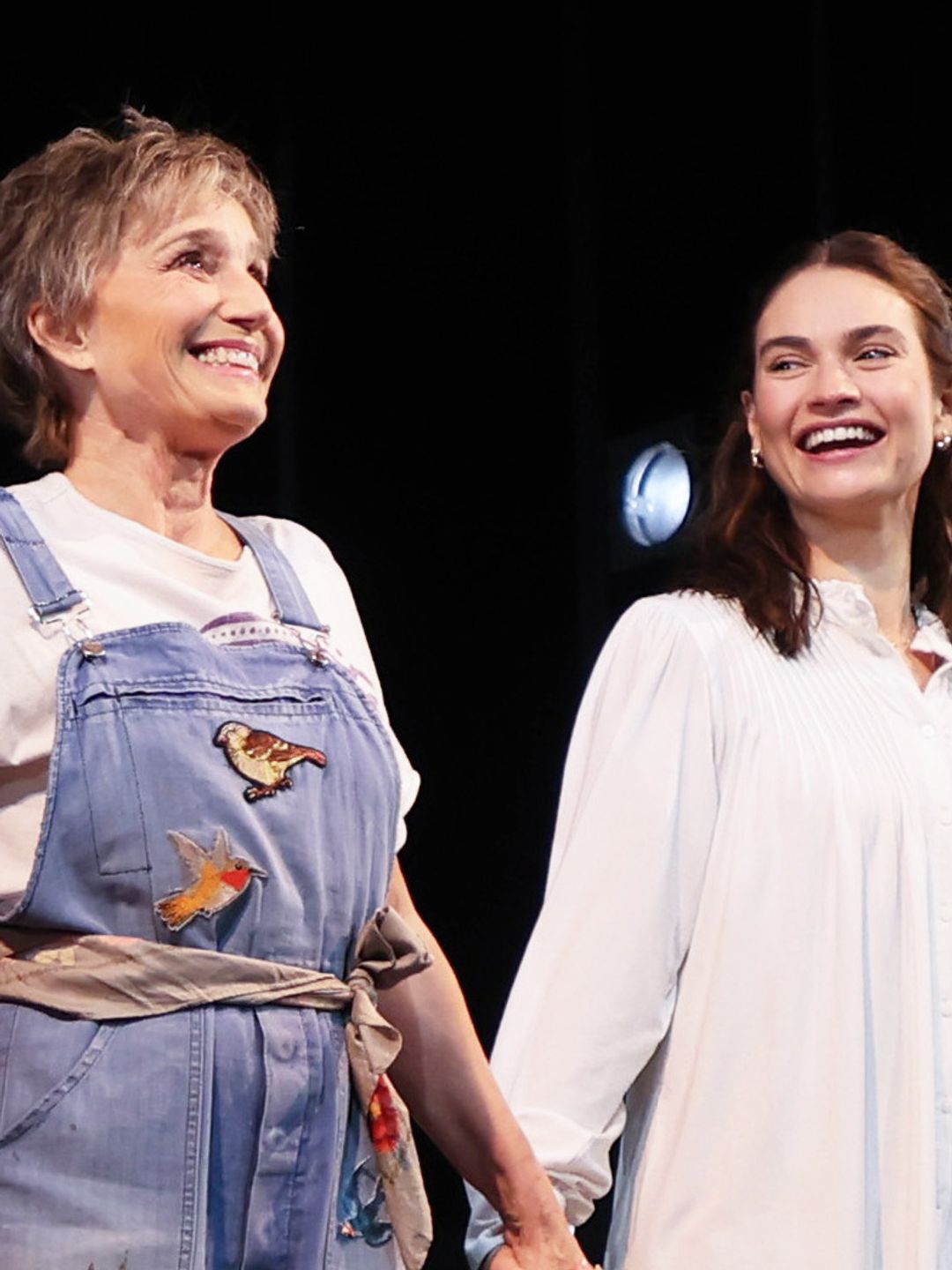 Lily James and Dame Kristin Scott Thomas taking their curtain call bow during the press performance of new play "Lyonesse" 