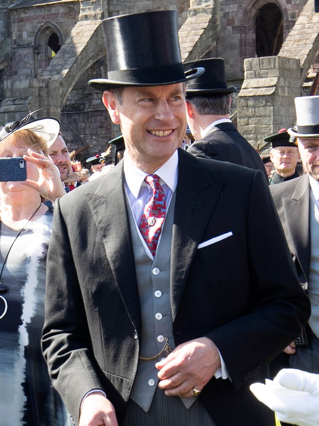 Prince Edward in a suit and top hat at a garden party