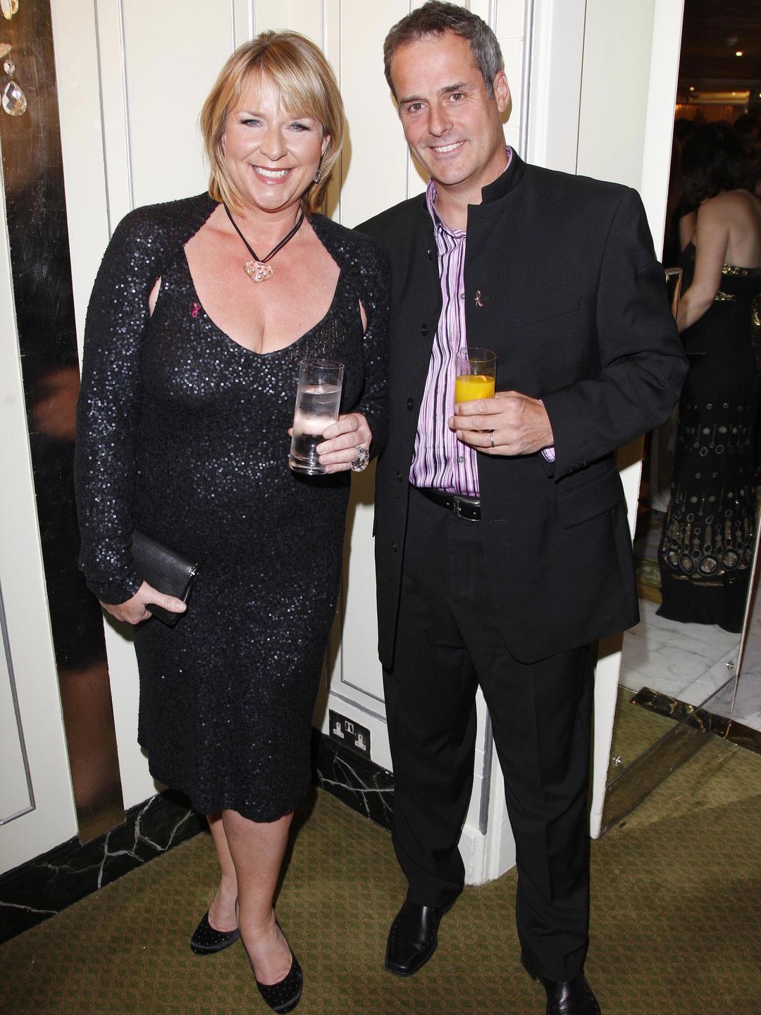 Fern Britton in a black dress alongside ex husband Phil Vickery in a suit