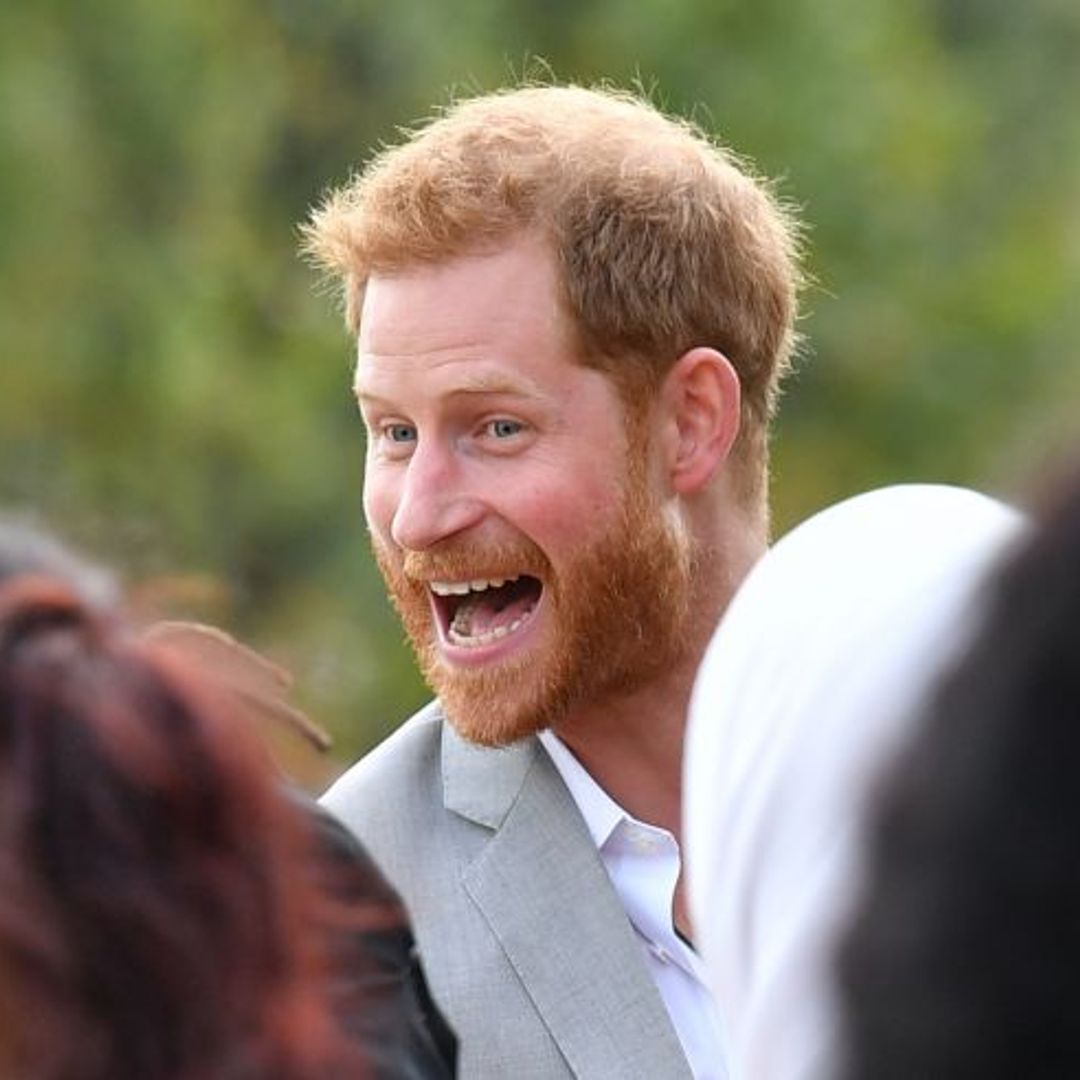 See the moment cheeky Prince Harry was caught stealing samosas from Meghan’s cookbook launch
