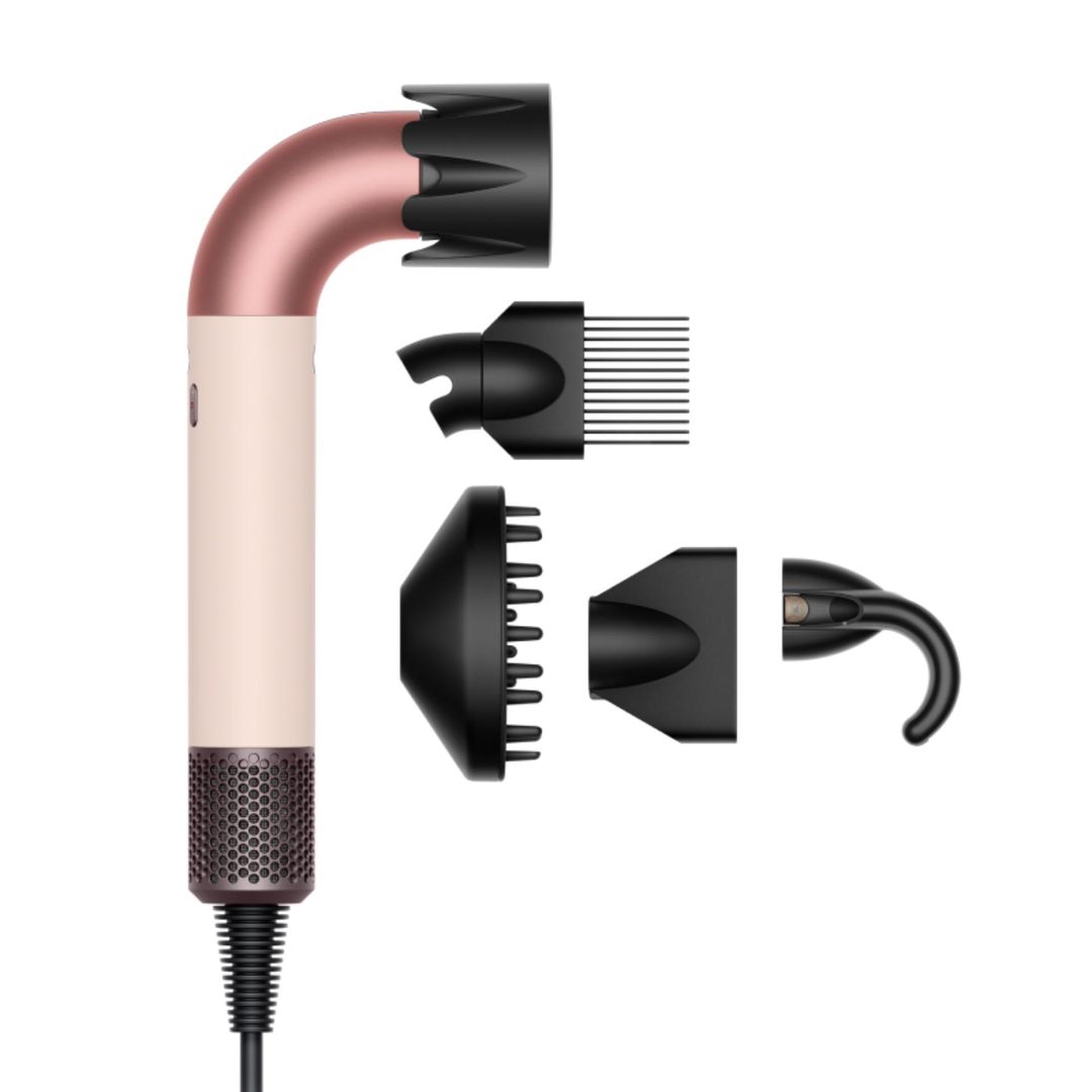pink dyson hairdryer with four attachments 