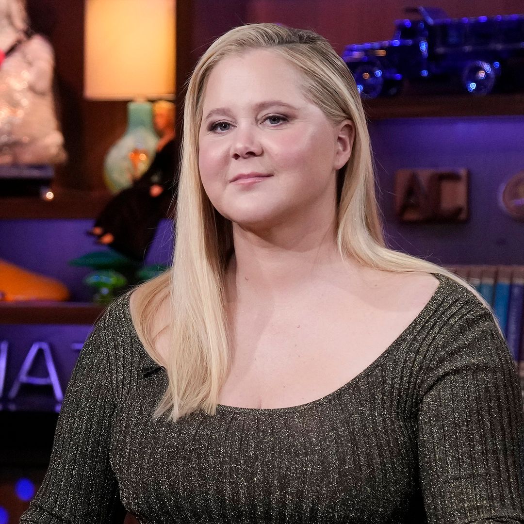 Amy Schumer showcases her incredible slimmed-down physique in fitted swimsuit