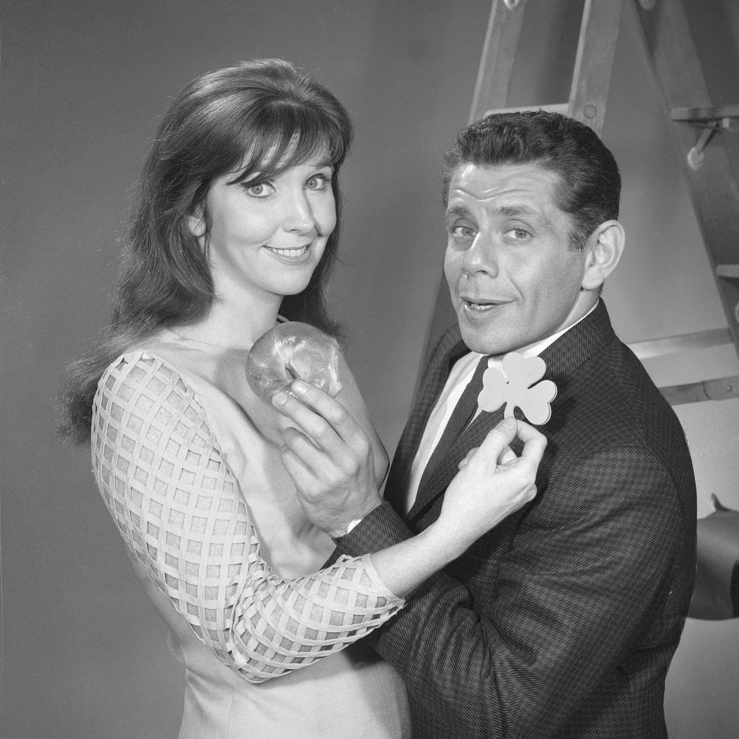 The husband and wife comedy team of Anne Meara and Jerry Stiller appears on the CBS variety program 'The Ed Sullivan Show,' New York, November 7, 1966. Meara holds a shamrock up to Stiller as he holds a bagel to her.