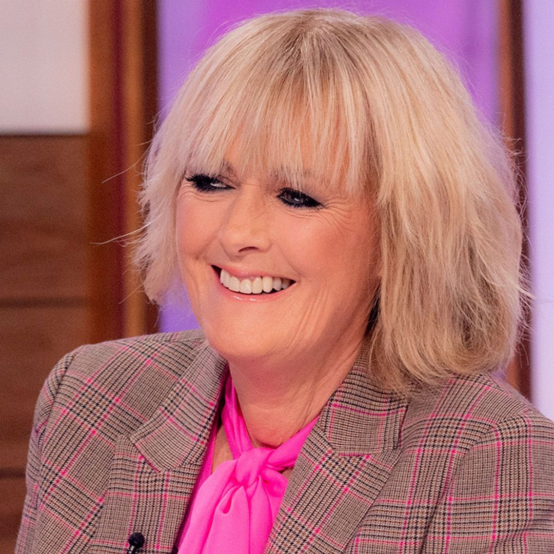 Jane Moore stuns in unusual silky look - and most amazing heels