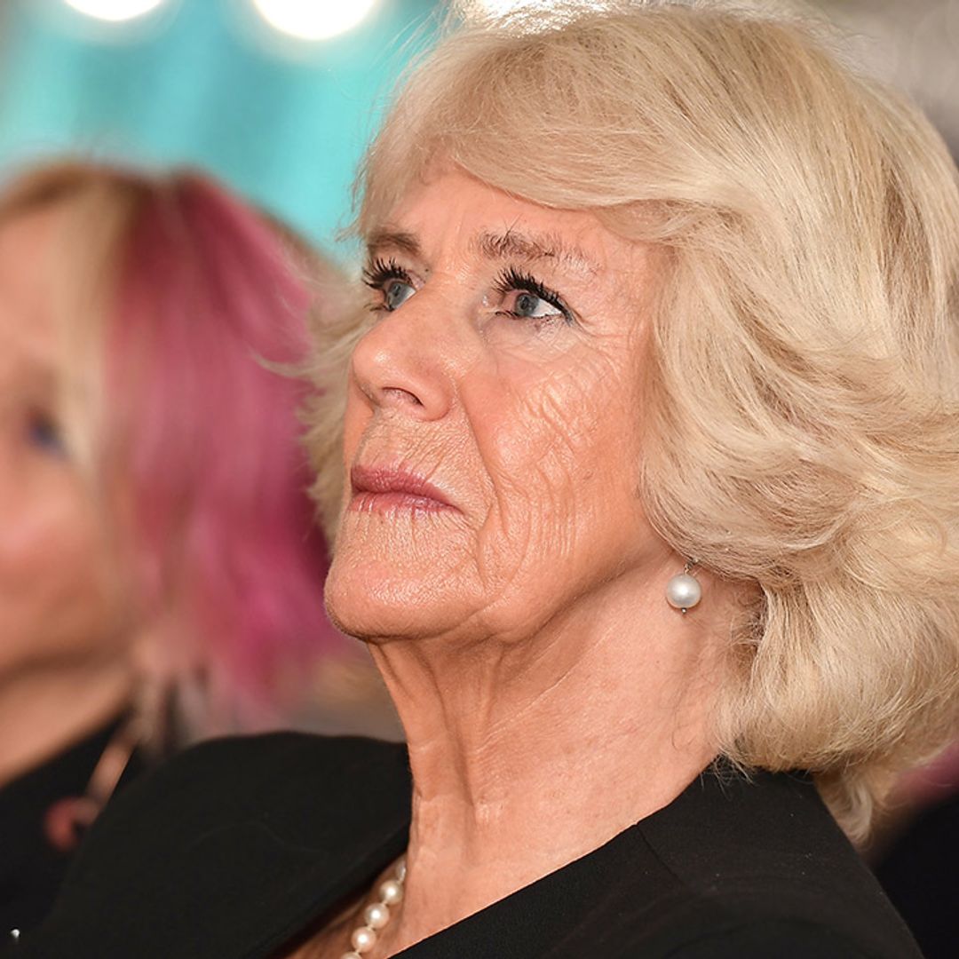 The Duchess of Cornwall wows in a cape coat  AND a handbag worth thousands