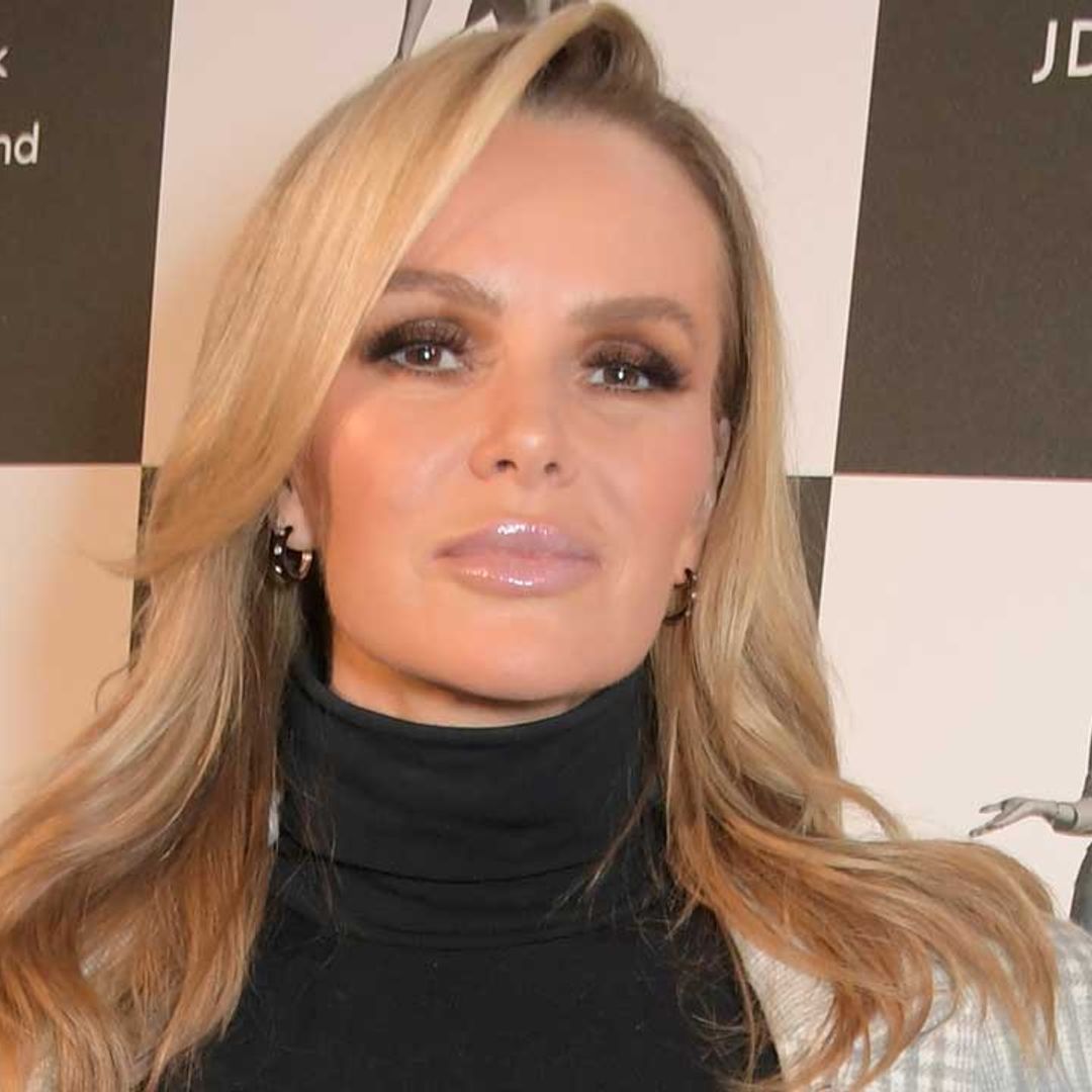 Amanda Holden stuns in waist-cinching leather dress and knee-high boots