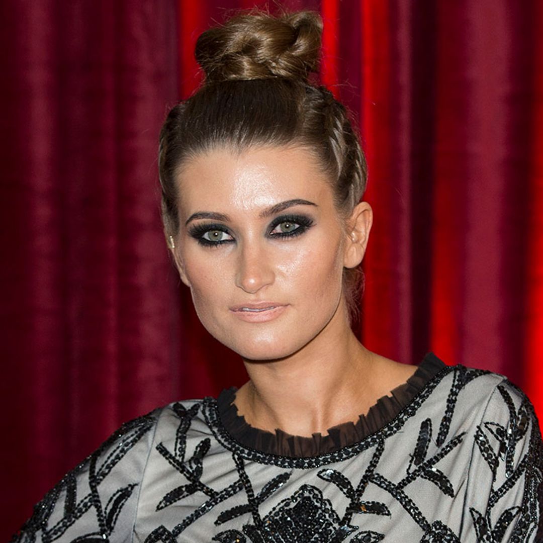 Charley Webb stuns in black swimsuit during family excursion
