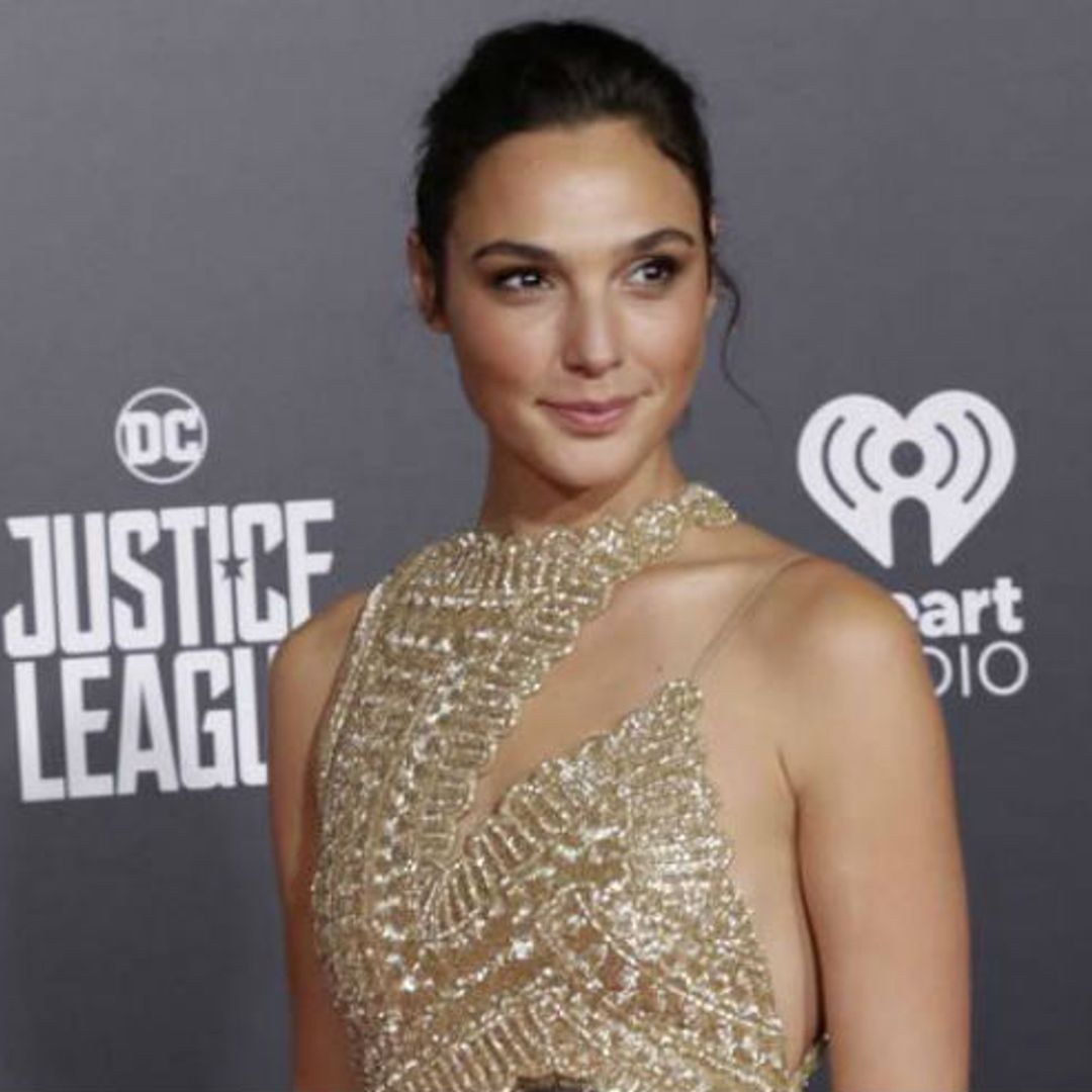 Gal Gadot turns heads in gold at Justice League premiere