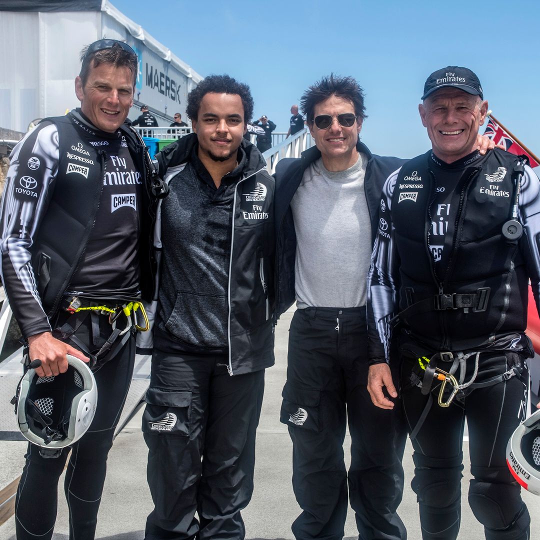 Connor and Tom stood with two other men in motor racing gear