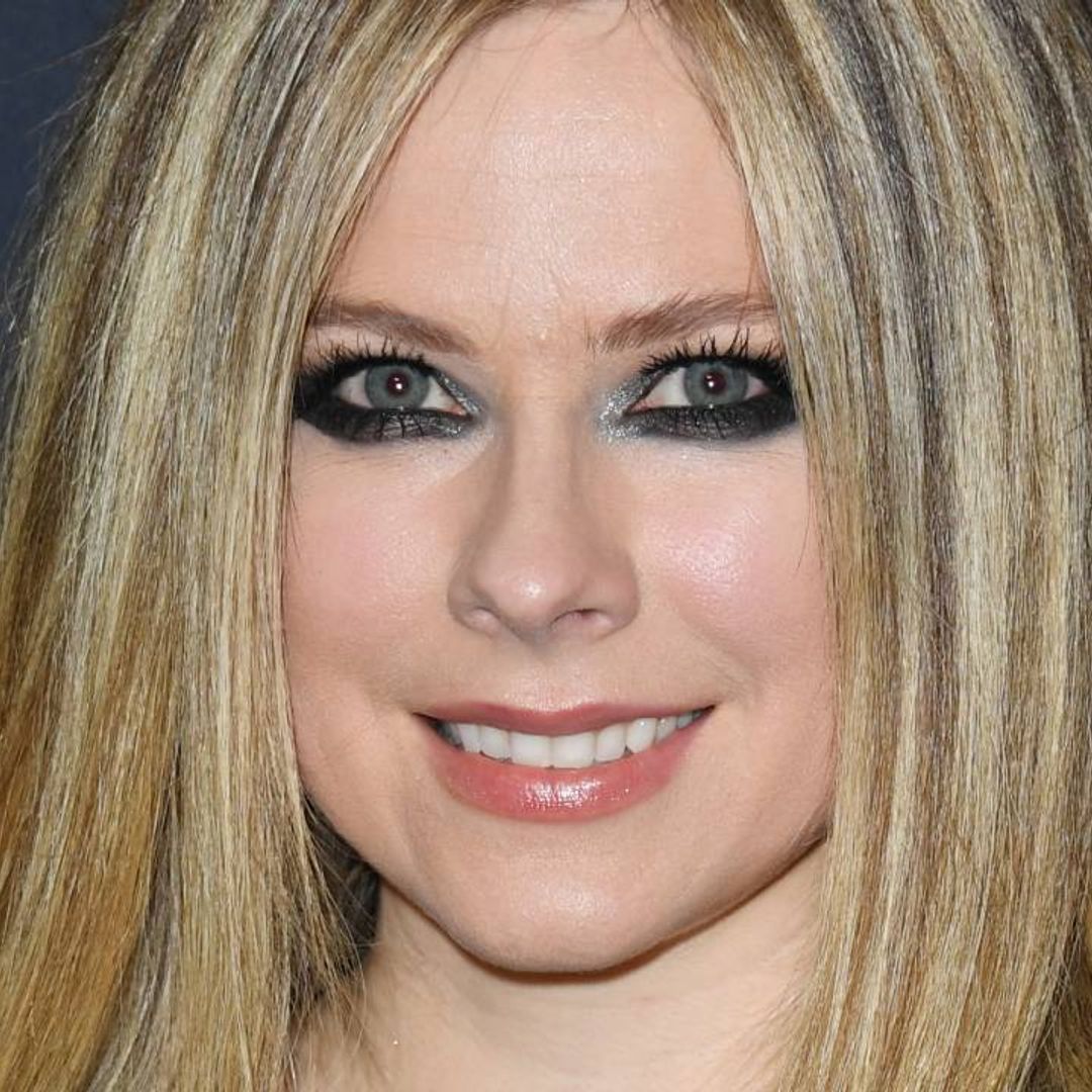 Avril Lavigne looks sensational in neon cut-out crop top as she poses alongside boyfriend Mod Sun