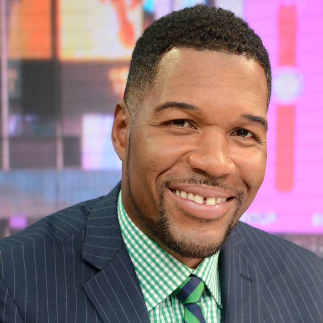 Michael Strahan is cheered on by fans as he celebrates achievement away from work