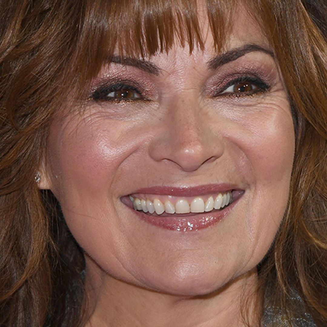 Lorraine Kelly wears the most fabulous red floral dress on her show and we need it in our wardrobe