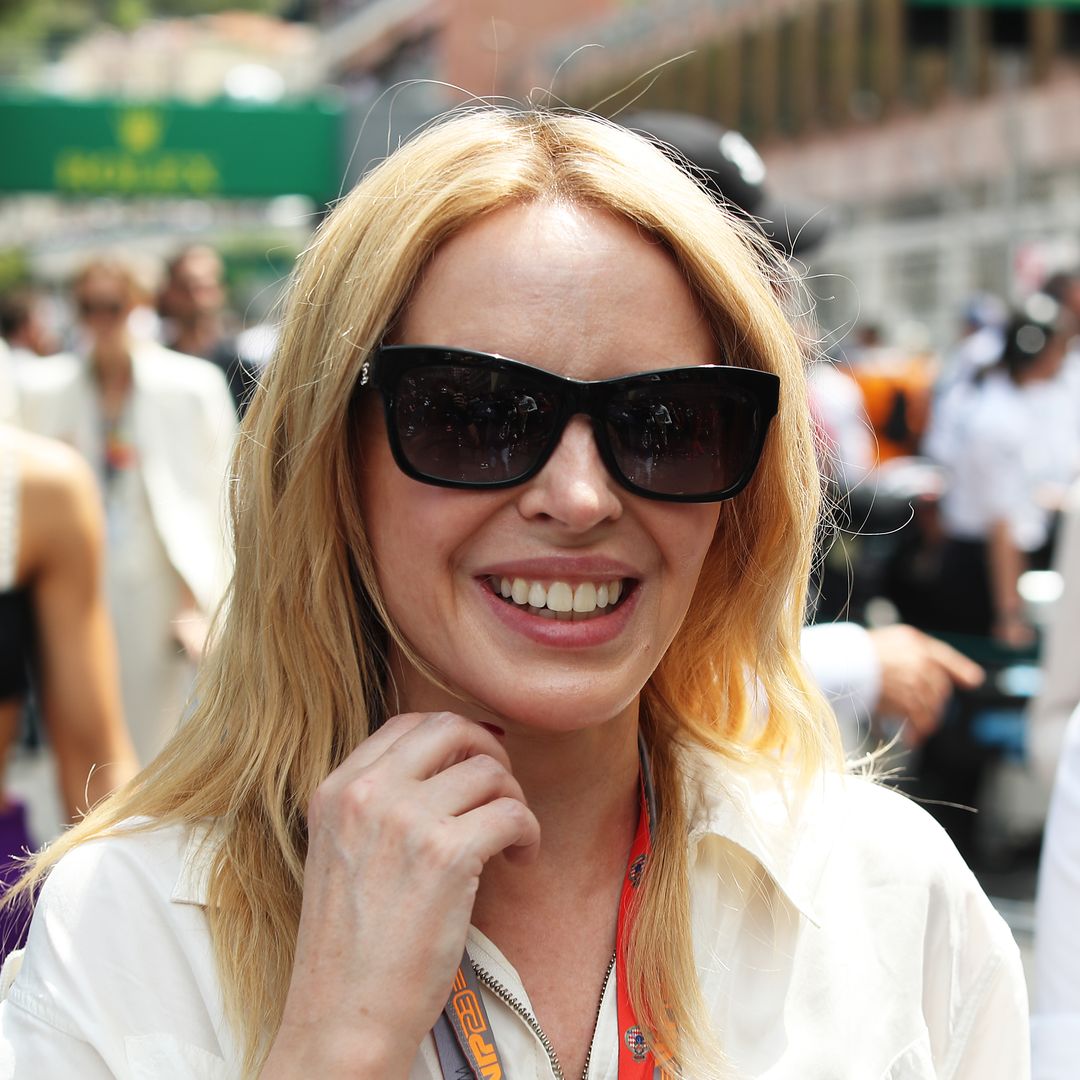 Kylie Minogue is a vixen in daring figure-hugging ensemble as she shares incredible news