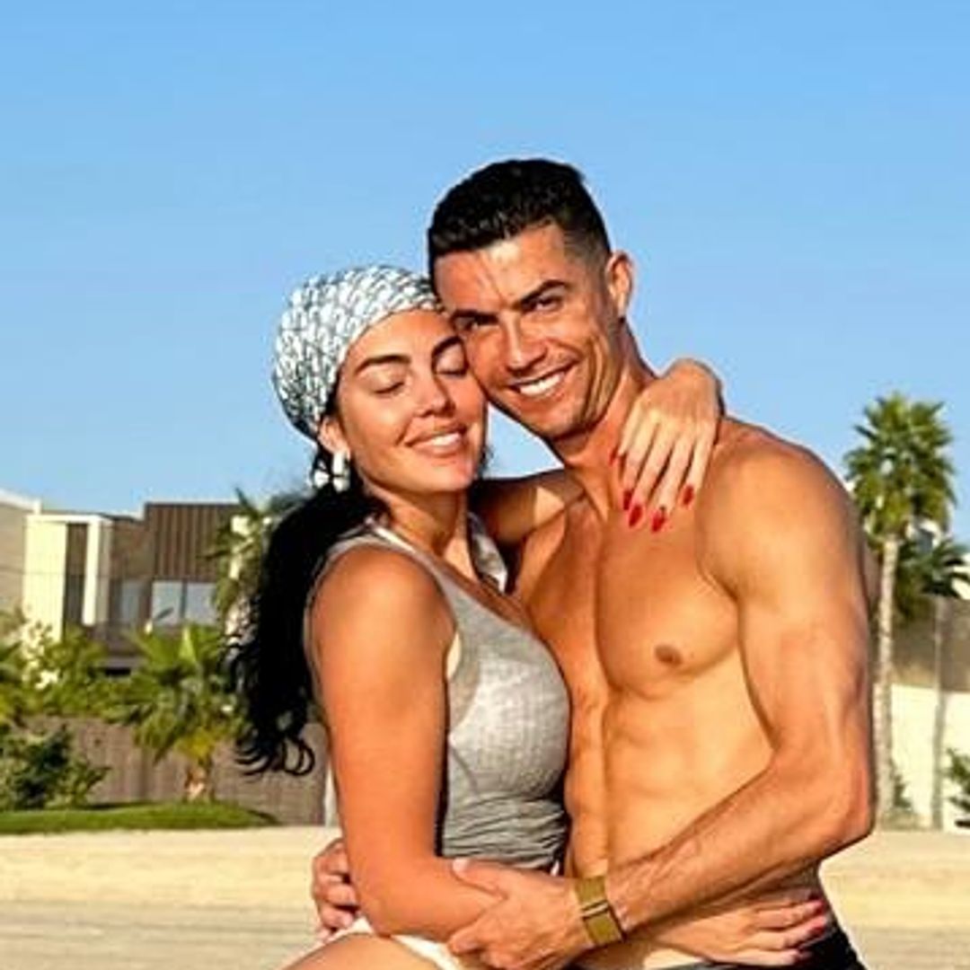 Cristiano Ronaldo poses alongside bikini-clad hoe Georgina followin suspension
