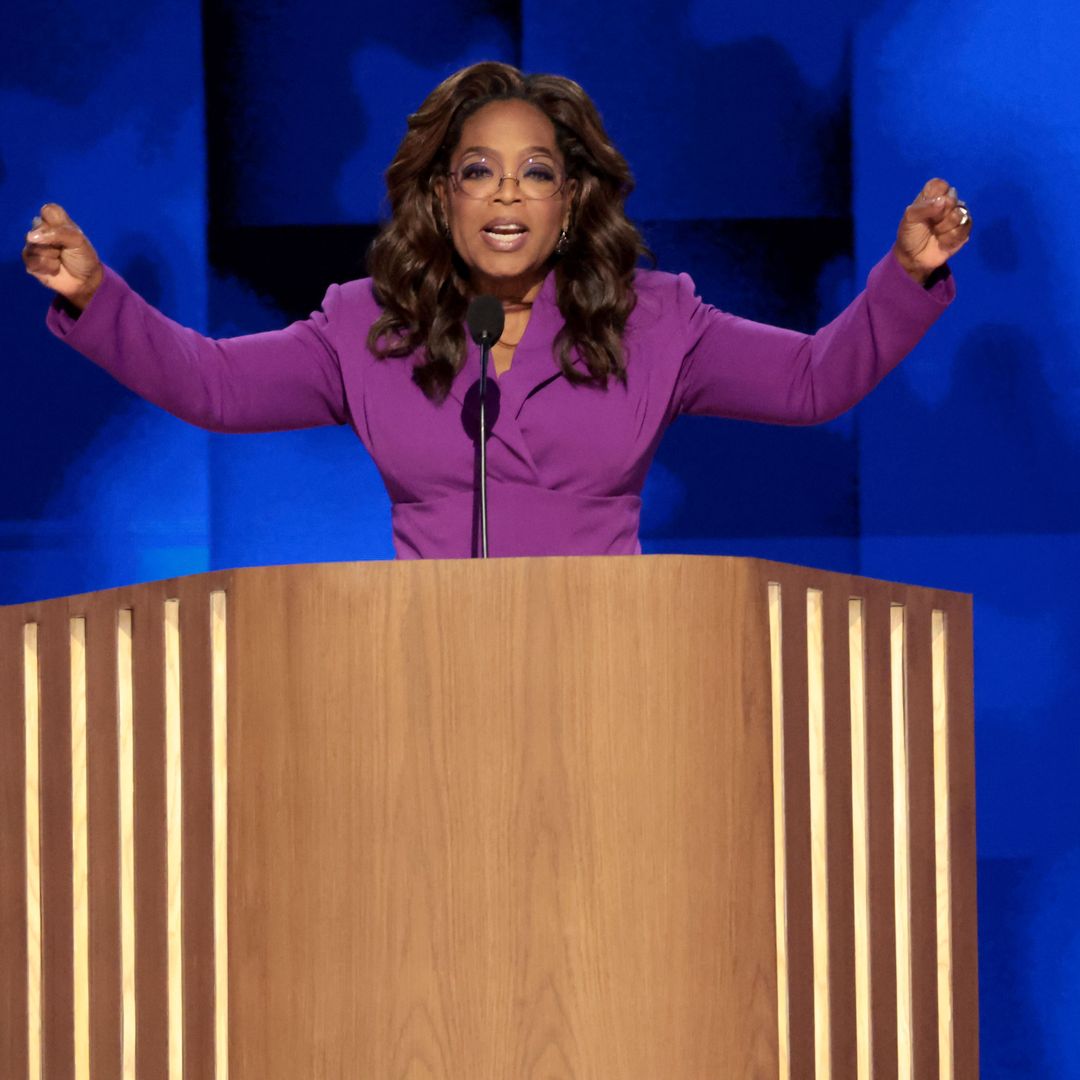 Oprah Winfrey looks phenomenal in waist-cinching purple suit as she makes surprise appearance