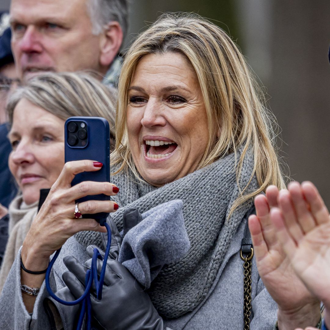 Proud mum Queen Maxima wipes a tear and takes pictures of daughter Princess Amalia completing major milestone