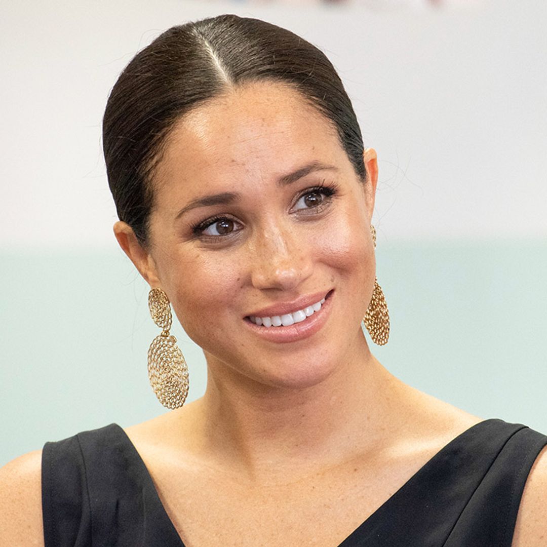 Meghan Markle all smiles as she is pictured for the first time since leaving the UK