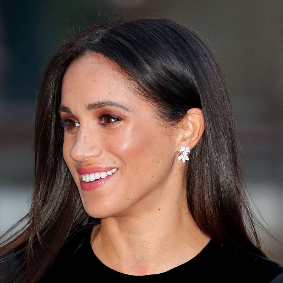 Meghan Markle wows in strapless black gown as she arrives solo at the ...