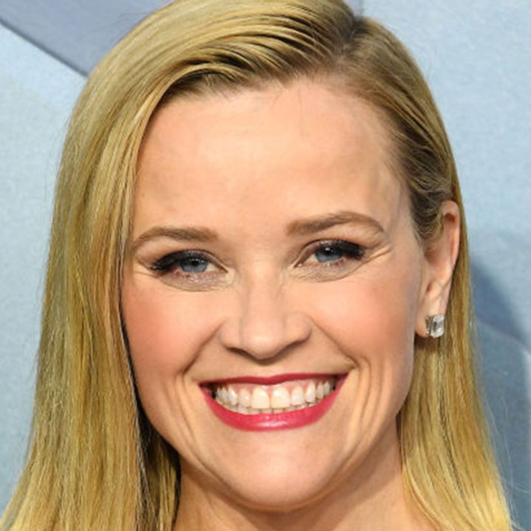 Reese Witherspoon declares romance book of the summer as she relaxes on sun lounger