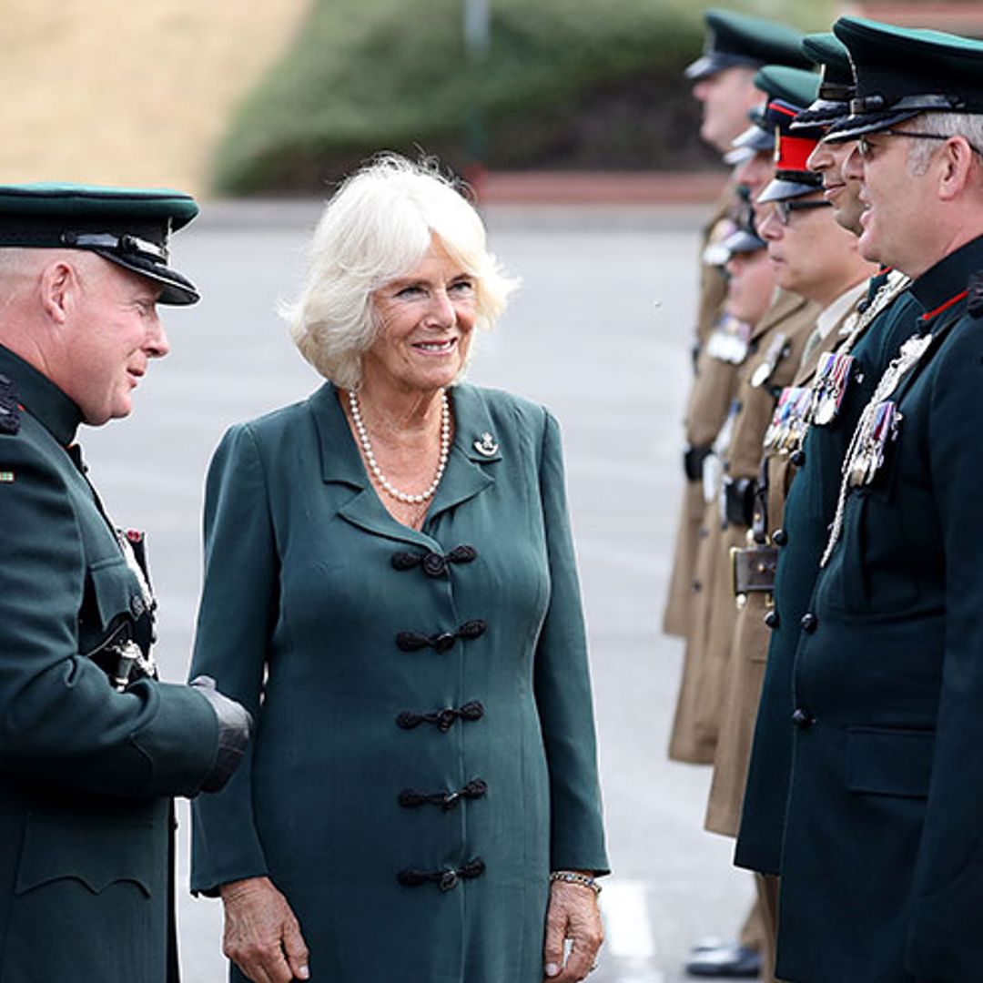 The Duchess of Cornwall wore a slinky military inspired dress to army barracks