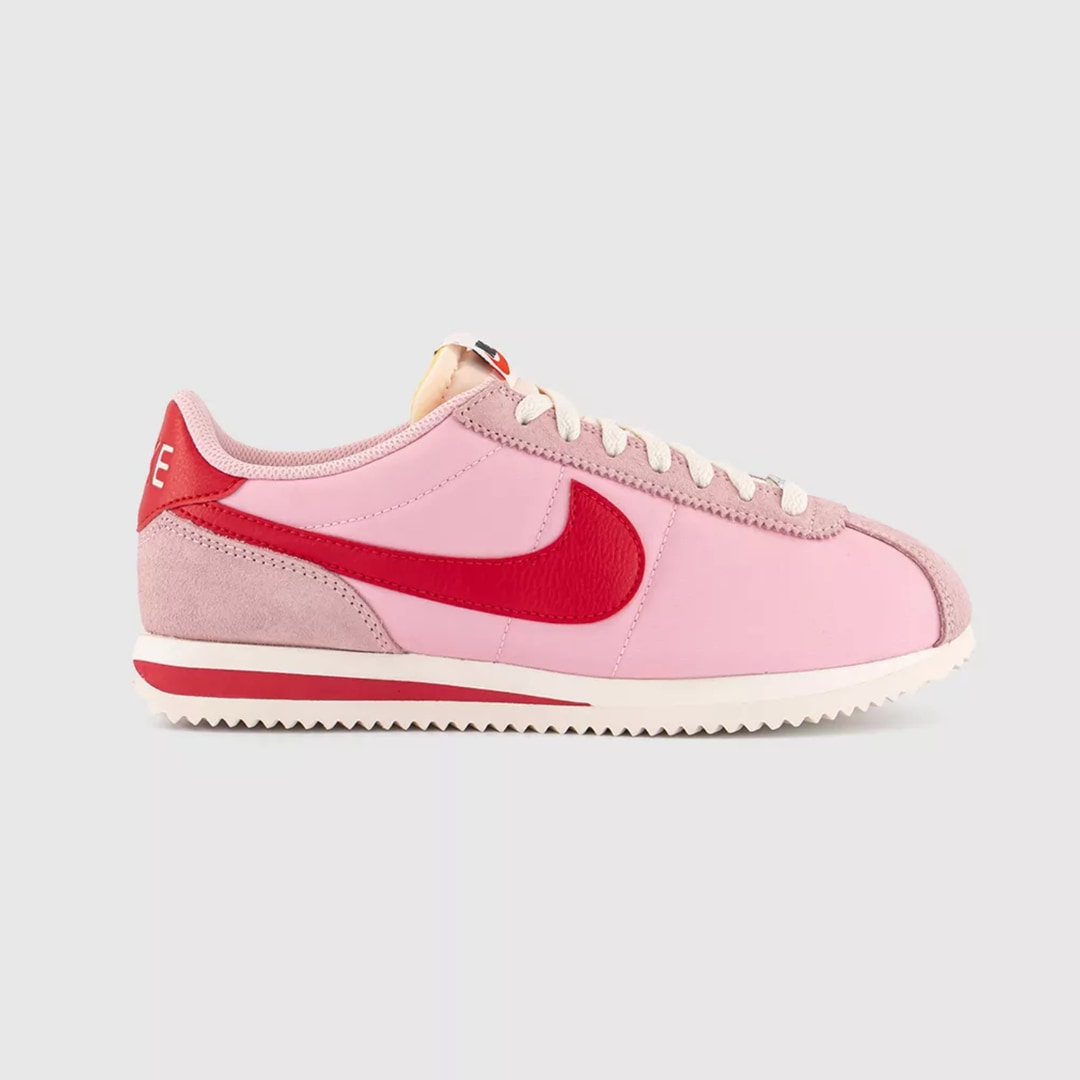 A photo of Nike Cortez Trainers Medium Soft Pink on a white background