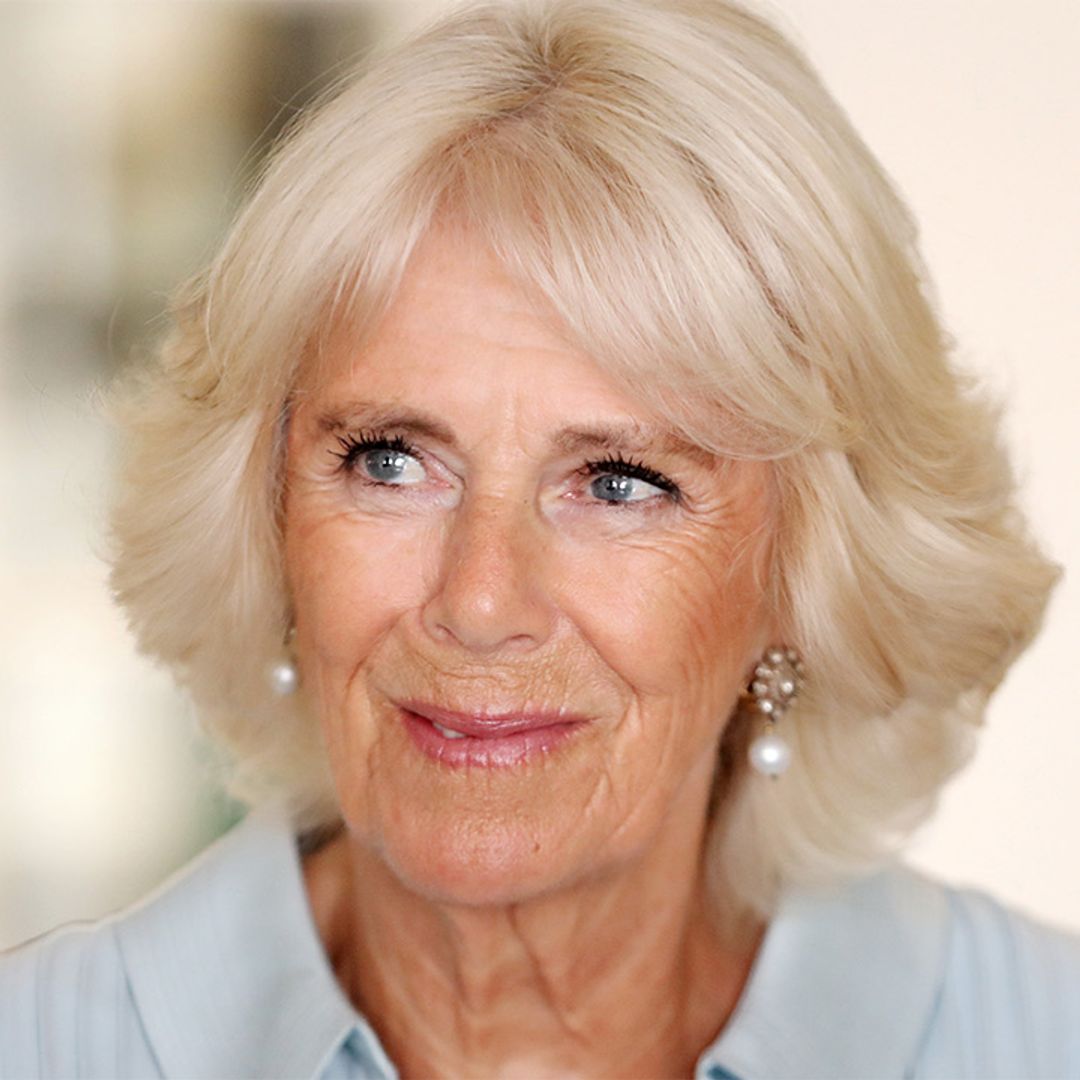 The Duchess of Cornwall shows off her tan in a sensational shirt dress