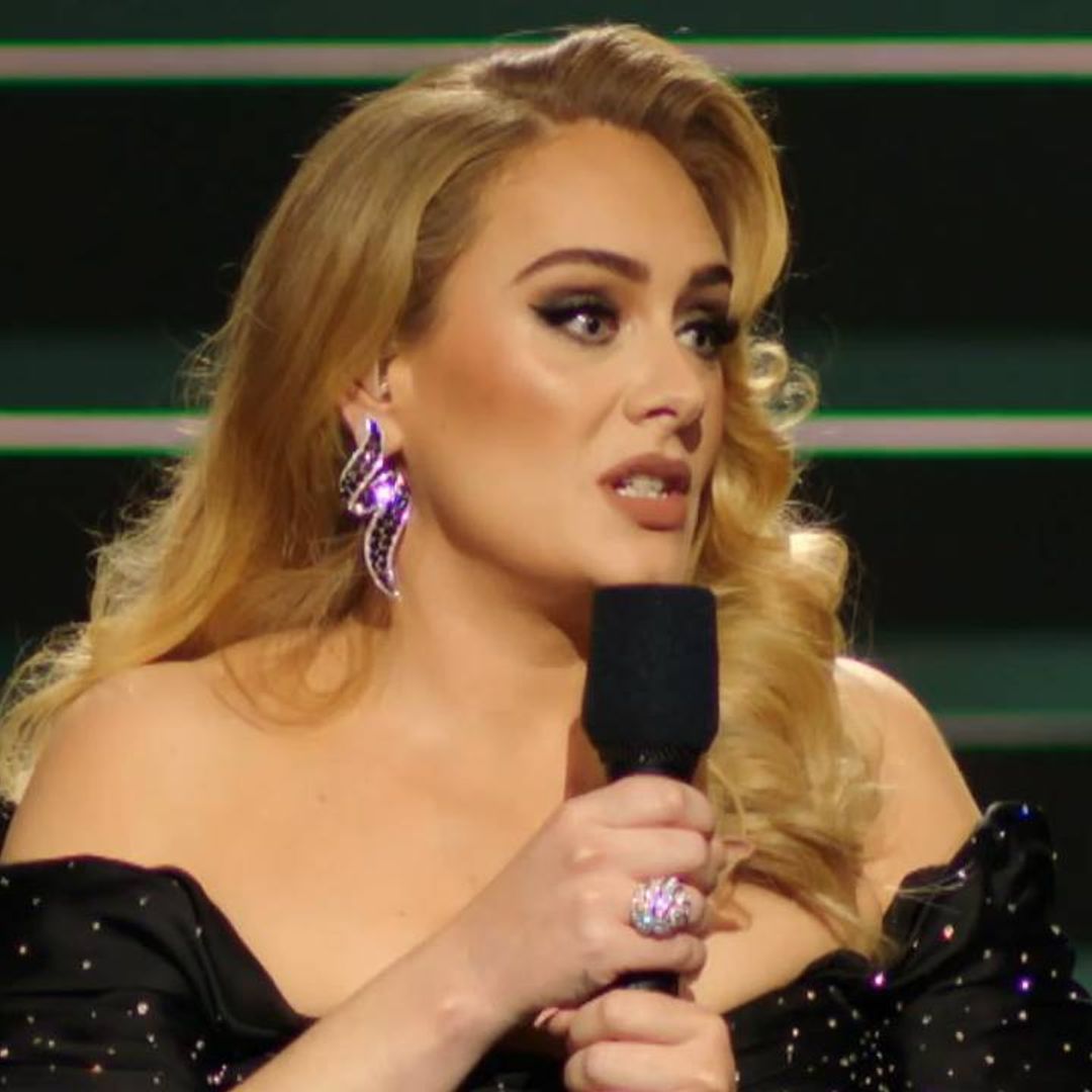 Adele shows off her tiny waist in stunning off-the-shoulder gown