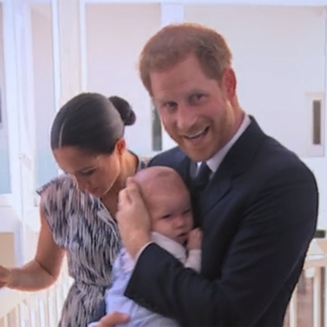 Prince Harry spotted rocking baby Archie in background of Africa documentary – watch video