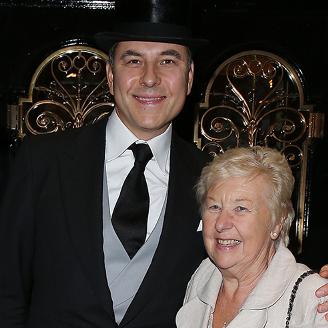 David Walliams supported by his mum as he receives OBE from Princess Anne