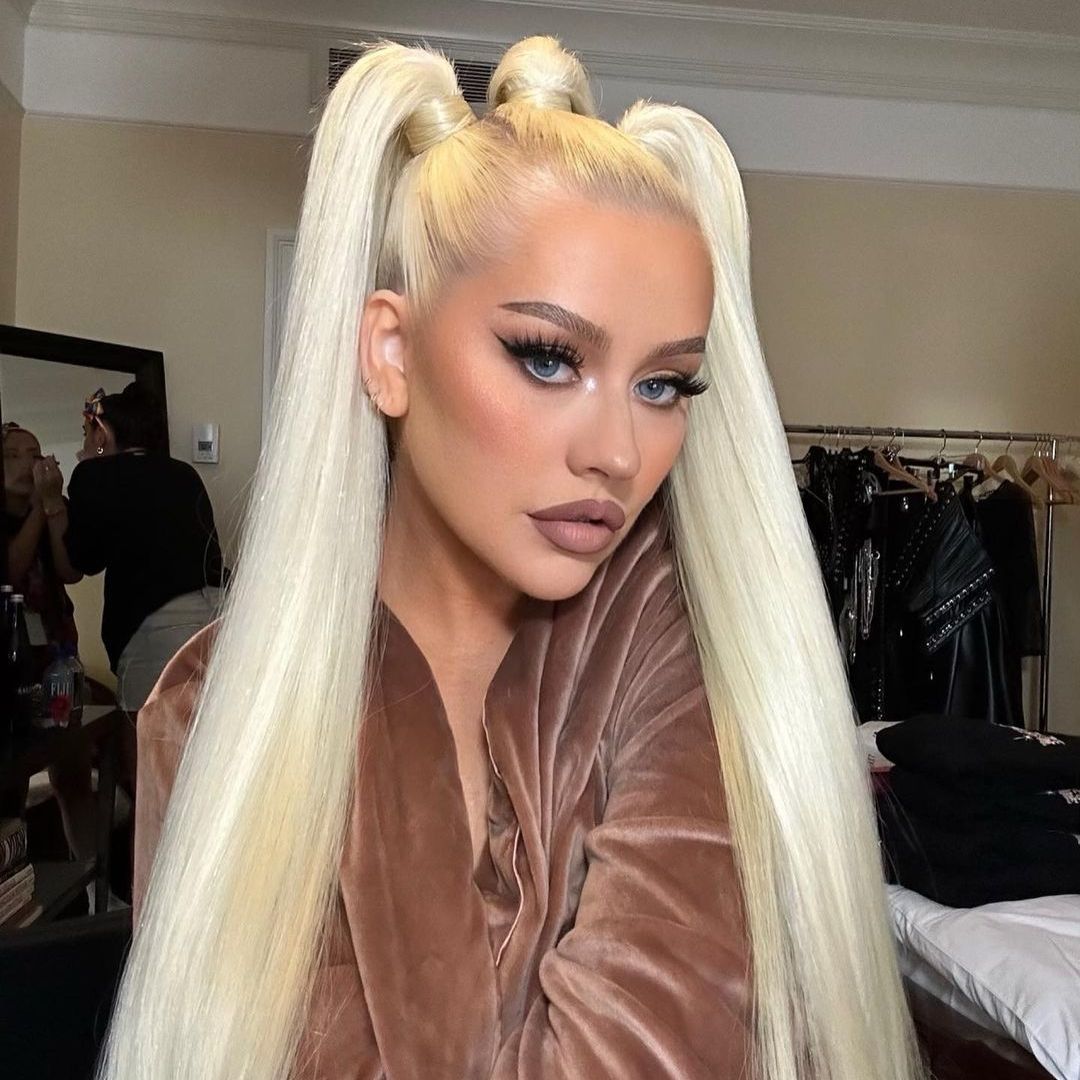 Christina Aguilera's lookalike daughter, 9, almost towers over her in adorable new photos