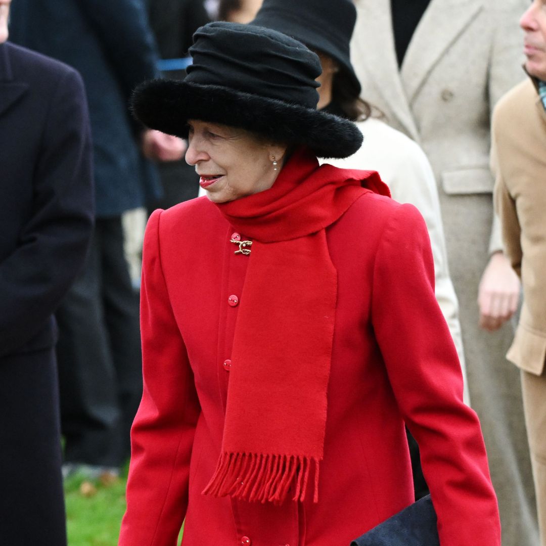 Princess Anne is the epitome of Christmas in red coat and tartan skirt