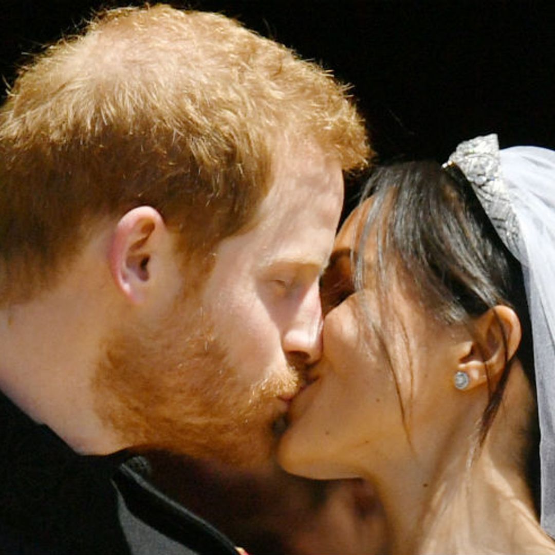 The kiss! Loved-up Prince Harry and Meghan Markle delight crowds