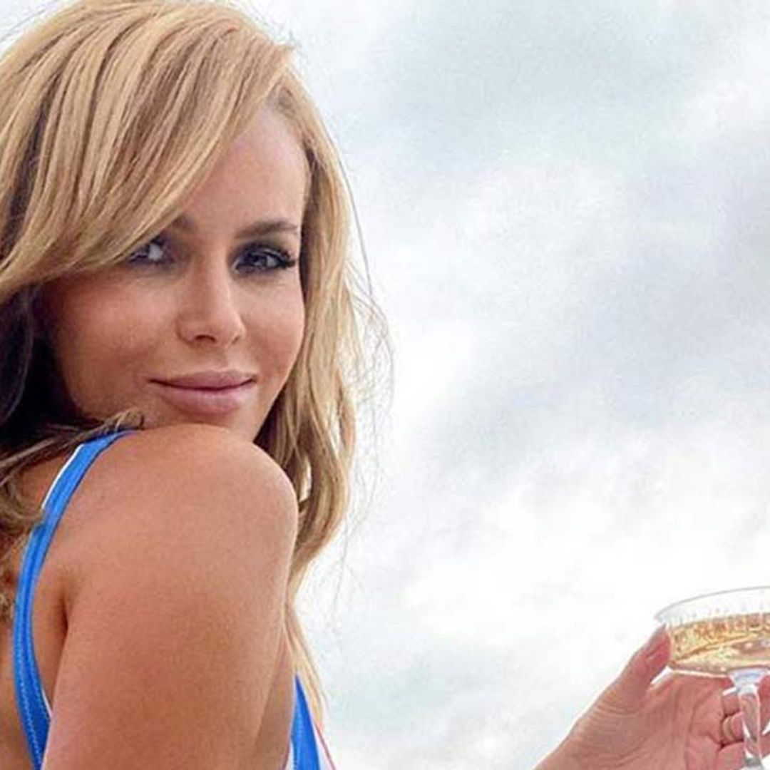 Amanda Holden causes a stir in plunging swimsuit on dreamy vacation