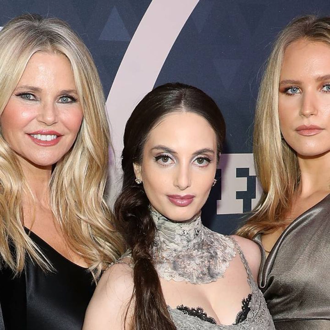 Christie Brinkley poses in just a shirt in stunning family portrait with daughters Sailor and Alexa