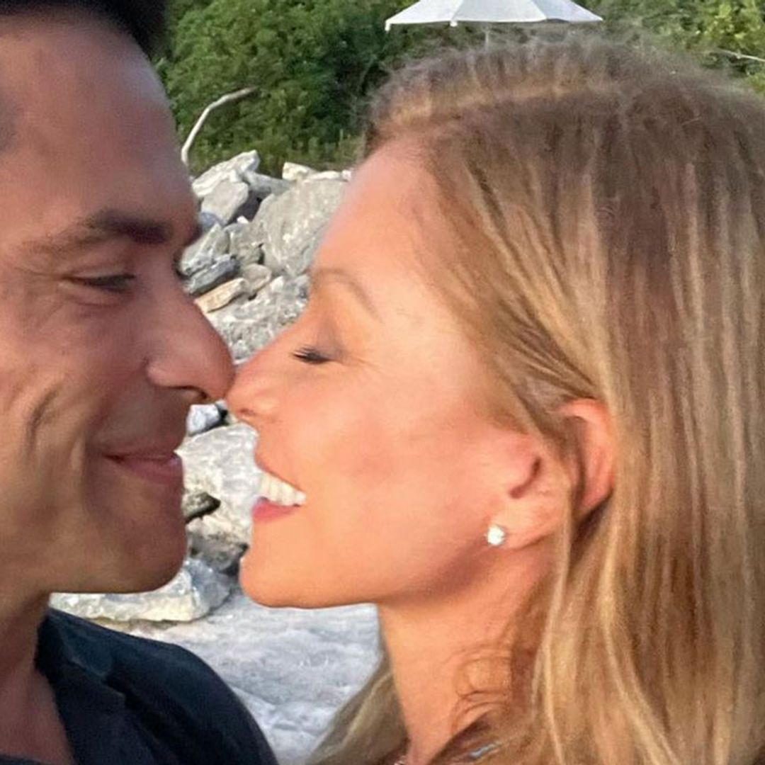 Kelly Ripa is unrecognisable as she dons mini white dress for incredible couple's photo