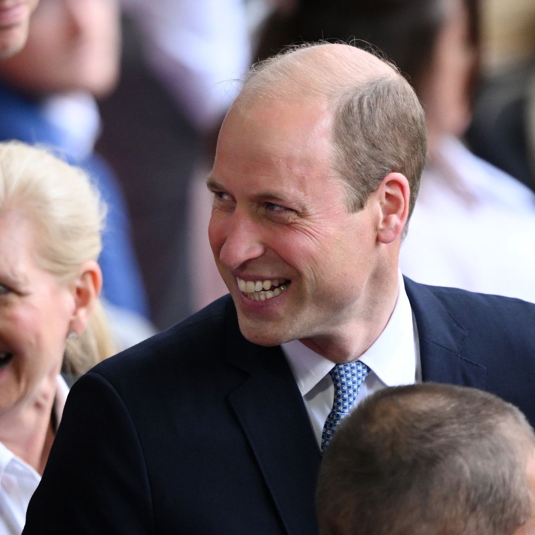 Prince William and equerry react to cheeky royal sign at Switzerland match