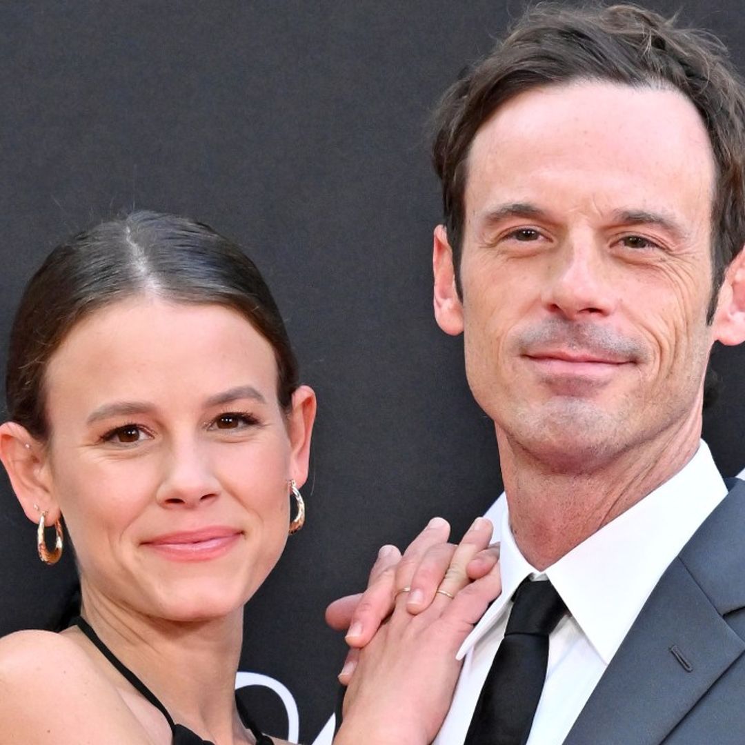 Sosie Bacon and Scoot McNairy look all loved up as they pose together on red carpet