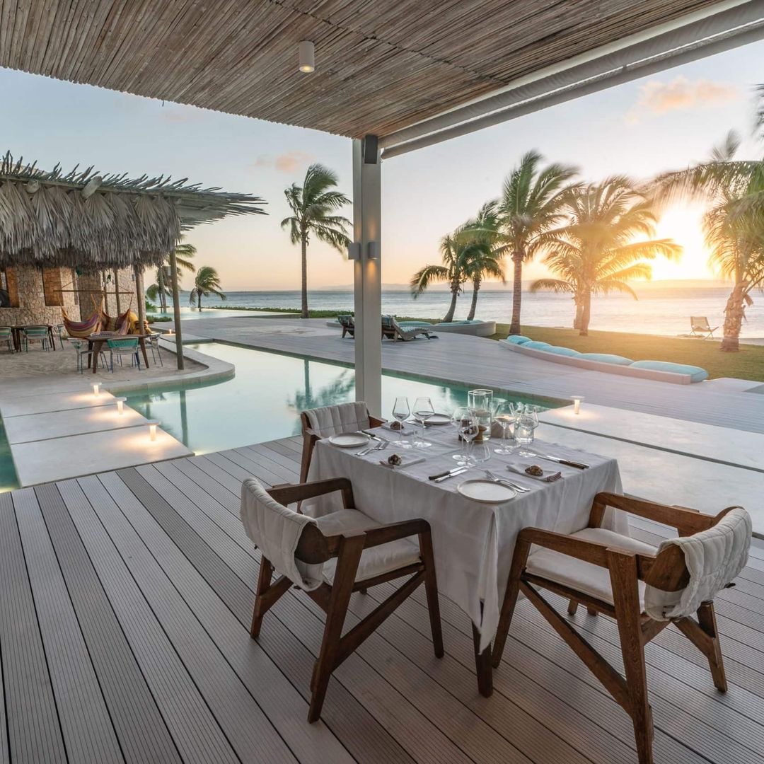 exterior dining table with sunset in background