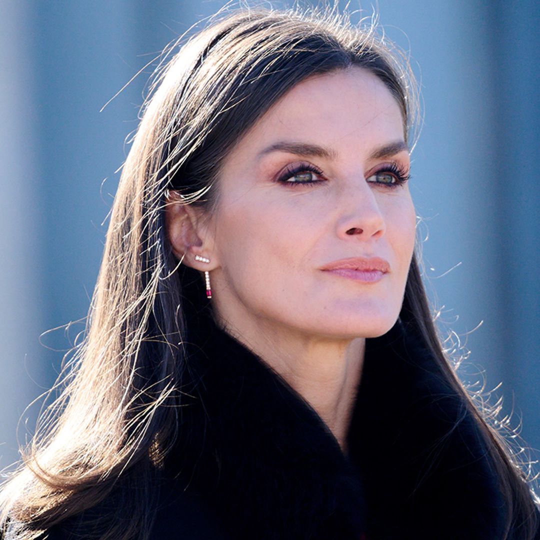 Queen Letizia is a gothic dream in silky lace dress and cape