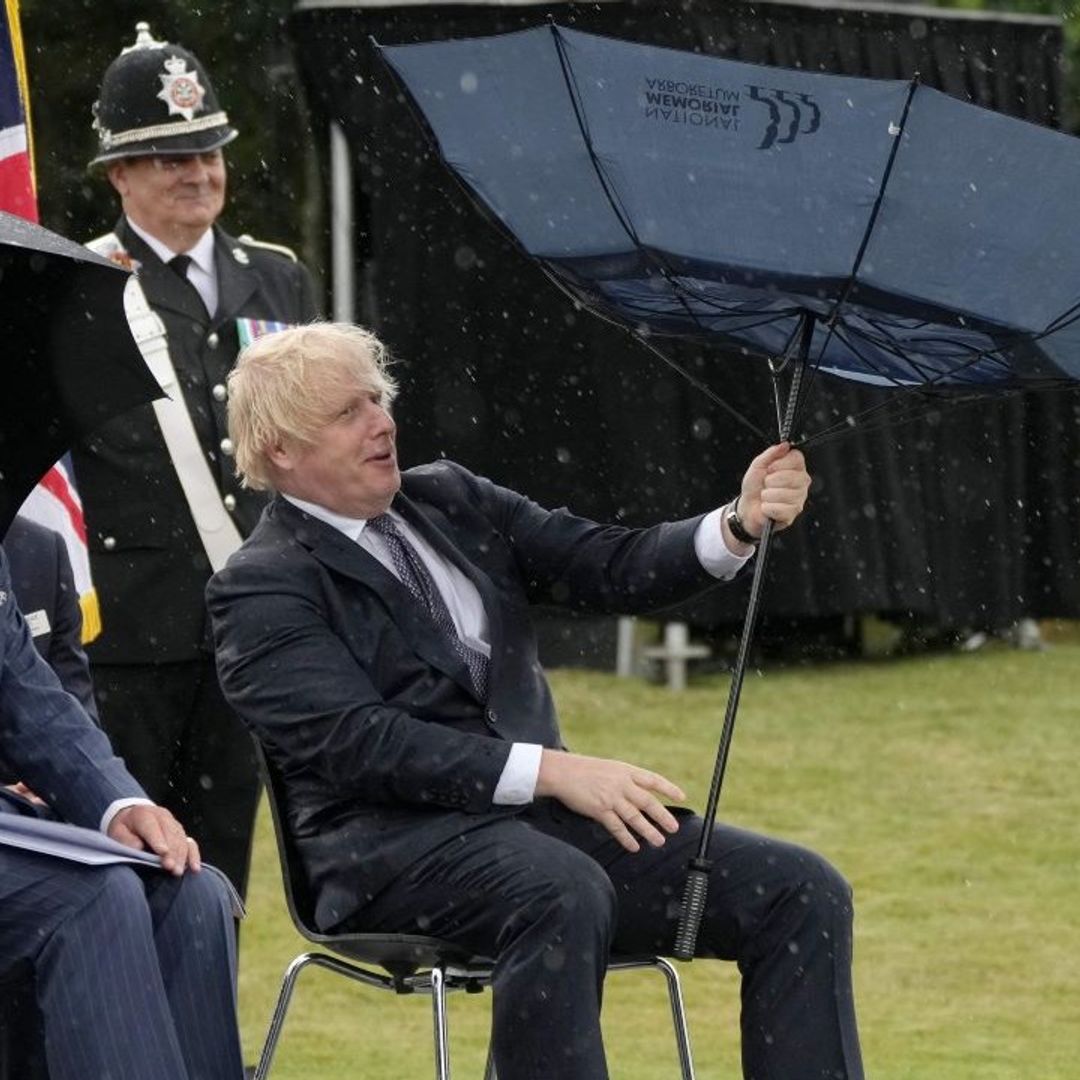 Prince Charles keeps his cool as Boris Johnson struggles with umbrella