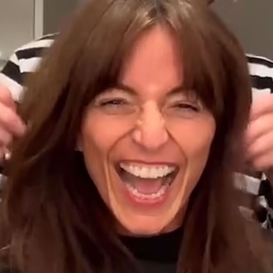 Davina McCall shows off her scar after brain tumour surgery as her partner gives her a haircut