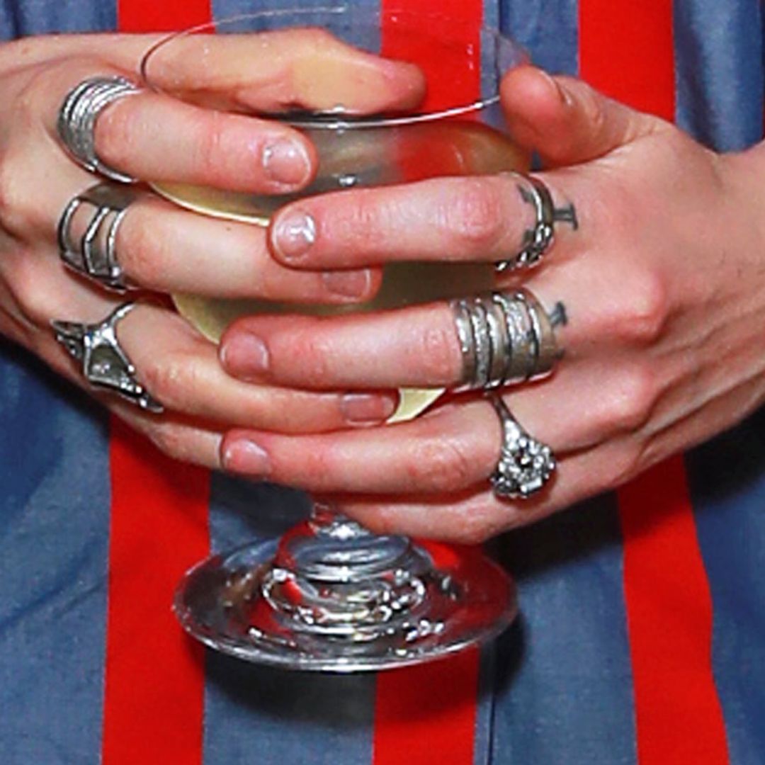 Imogen Poots holding a glass and wearing her engagement ring