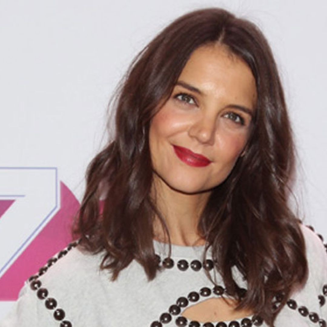 Video: Katie Holmes has the perfect wiggle backstage at Red Dress Fashion Show