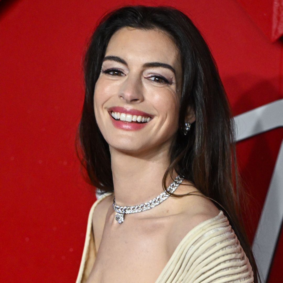 Anne Hathaway is a goddess in bejewelled strapless crop top with thigh-split skirt