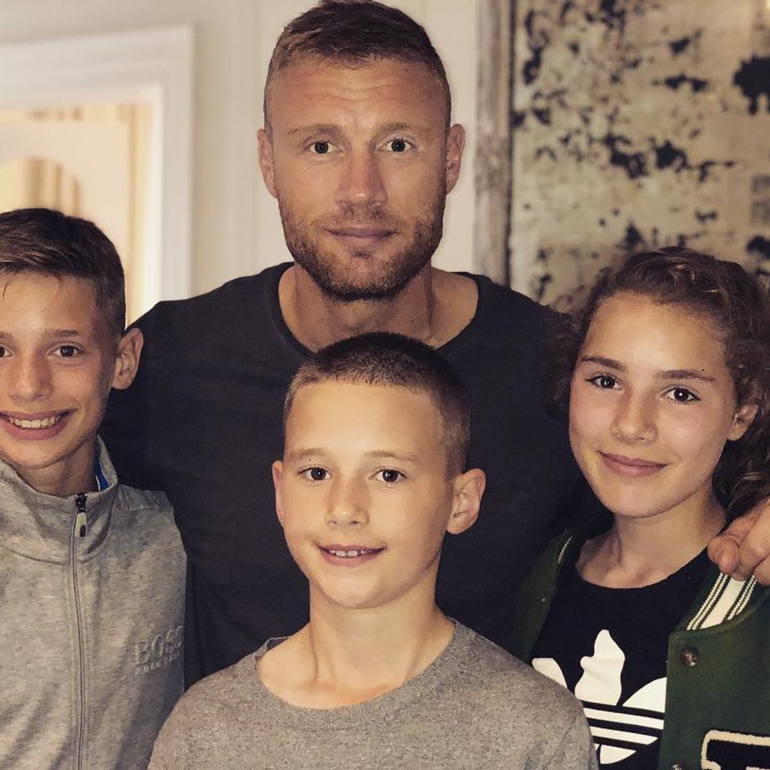 The cricket star posing with three of his four children