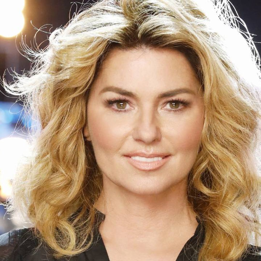 Shania Twain looks like a real life princess in metallic pink gown in celebratory stage photo