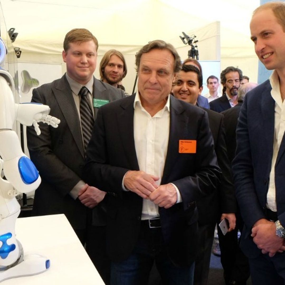 Prince William gets serious about cyberbullying but also has fun watching a robot dance to Daft Punk