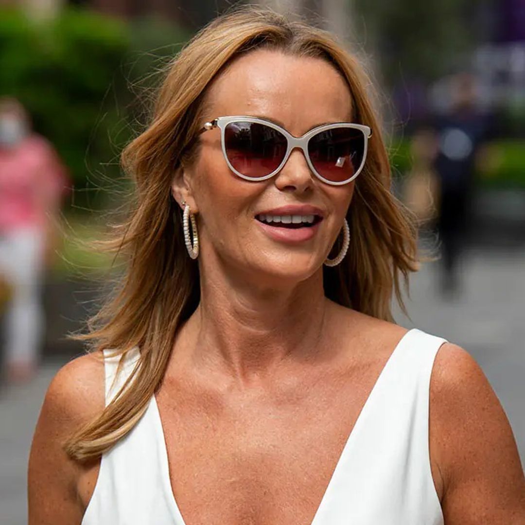 Amanda Holden is the ultimate beach babe in her floaty playsuit