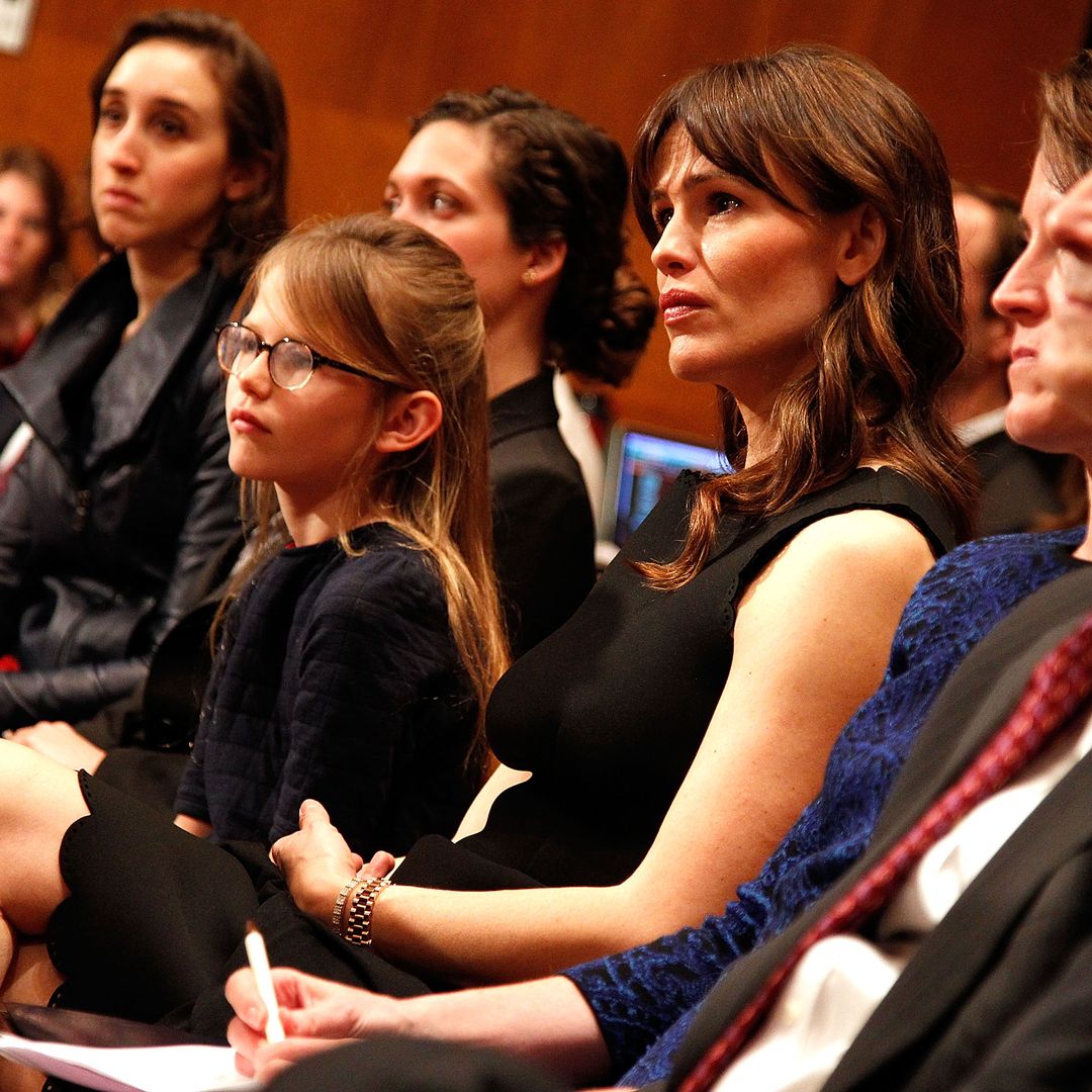 Actress Jennifer Garner (C) and her daughter Violet Affleck listen to Ben Affleck testify before a Senate Appropriations State, Foreign Operations, and Related Programs Subcommittee hearing on "Diplomacy, Development, and National Security" on Capitol Hill in Washington March 26, 2015.