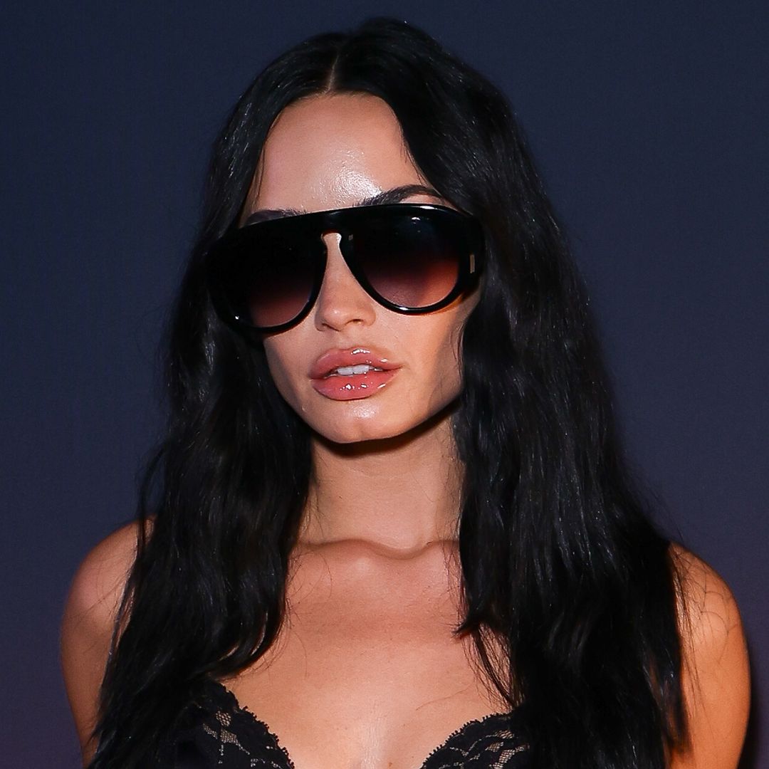 Demi Lovato highlights slim waist in leather and lace look